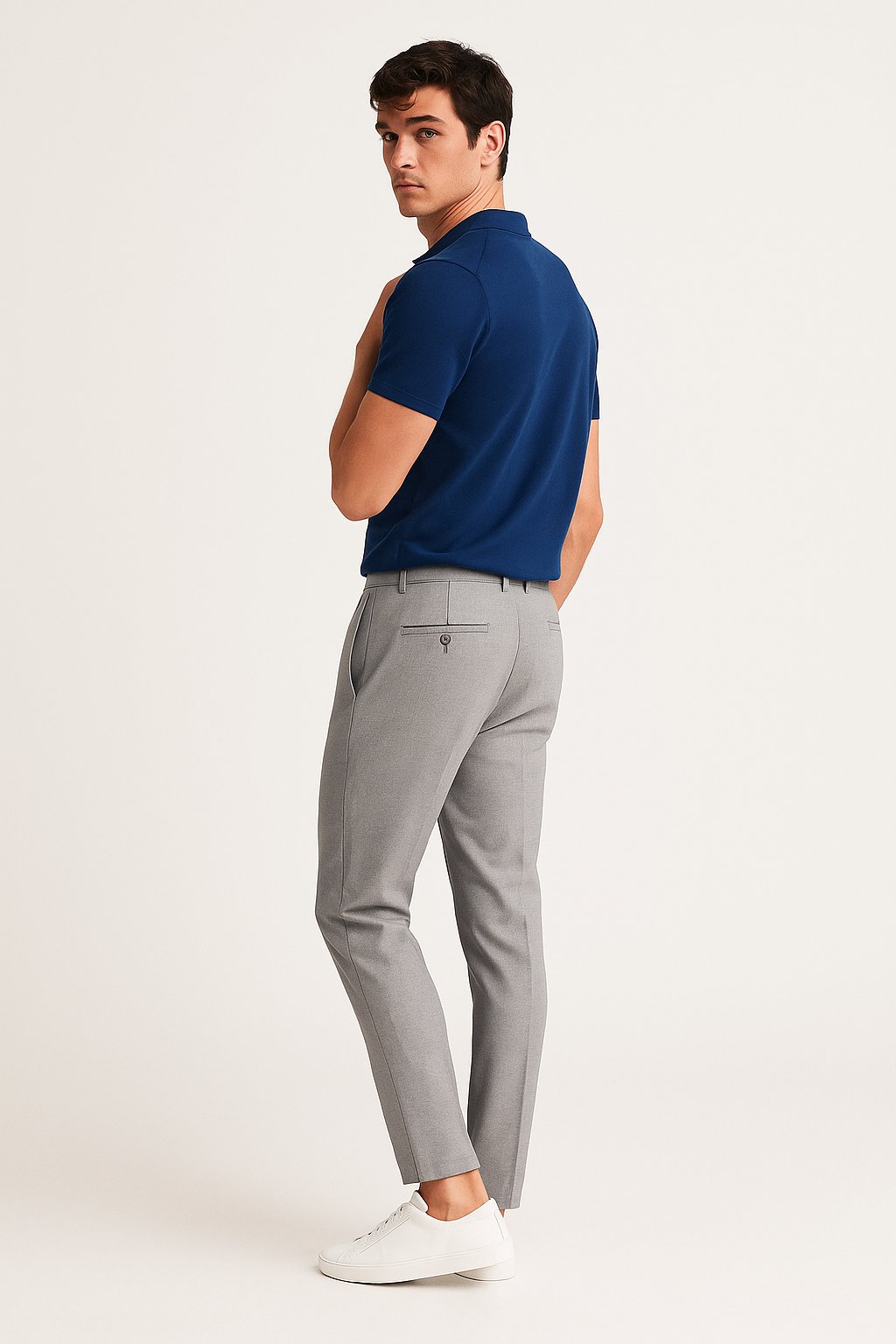 Front detail of men's slim-fit tailored chinos, featuring comfortable woven fabric & a modern leg.