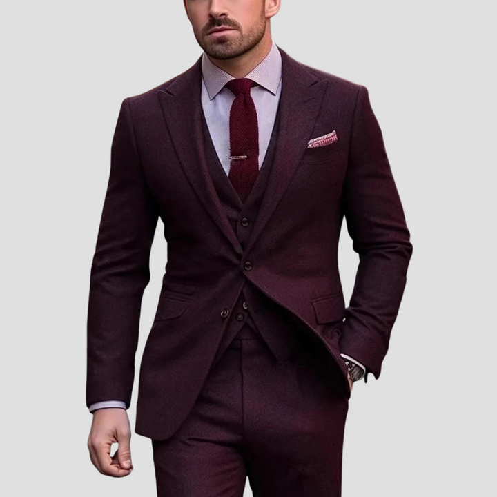 Elegant men's slim fit three-piece suit, perfect for weddings or business attire. Modern tailored design.