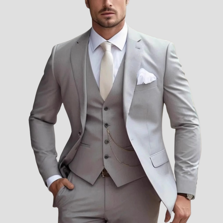 High-quality men's slim fit three-piece formal suit. Detailed tailoring & fabric for a sophisticated, sharp appearance.