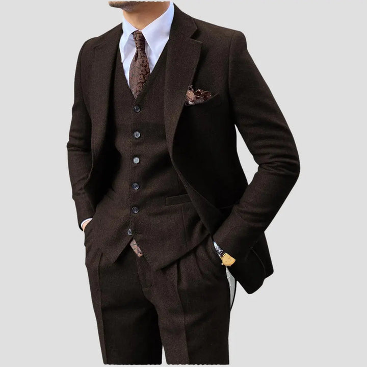 Sophisticated men's three-piece suit: slim fit jacket, trousers & vest for smart formalwear.