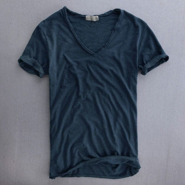 Close-up of a men's short sleeve V-neck t-shirt, showing slim fit and lightweight casual summer design.