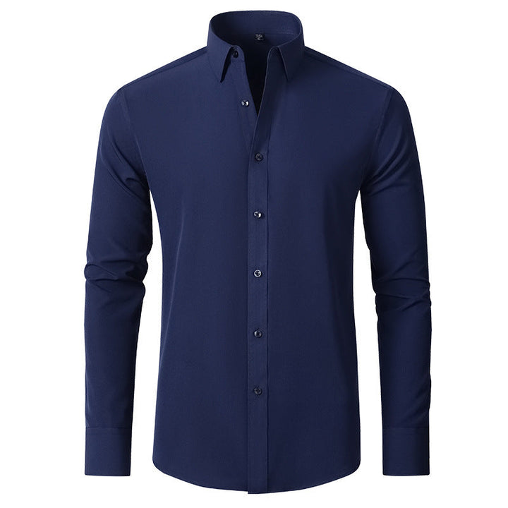 Close-up of a men's long sleeve button-down dress shirt cuff, showcasing wrinkle-resistant stretch fabric detail.