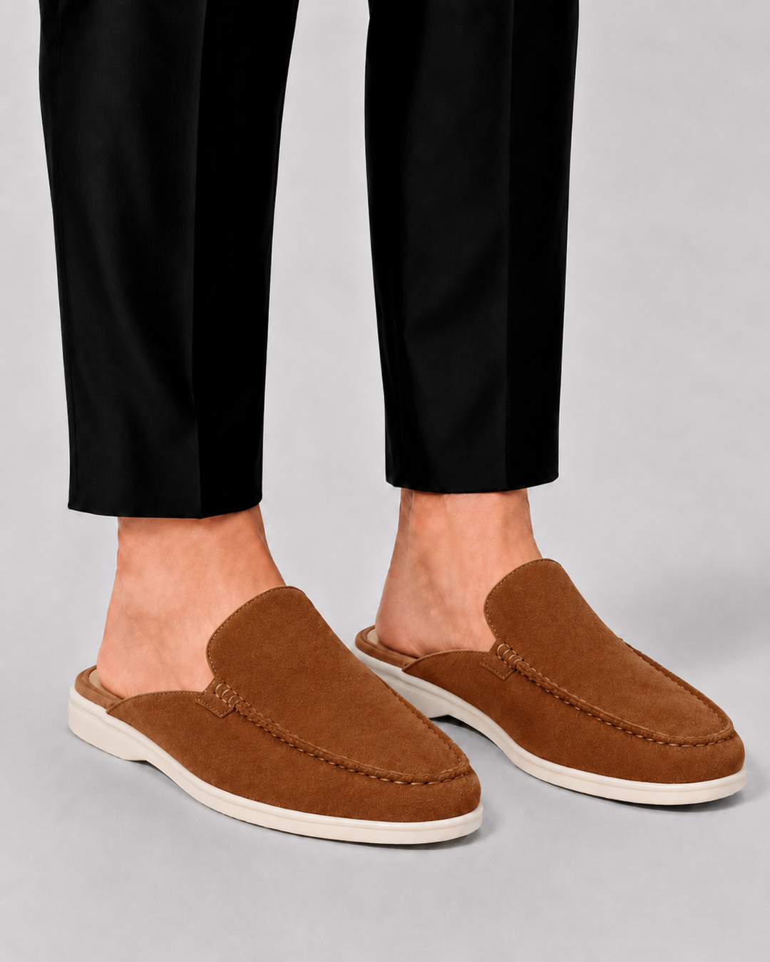 Lightweight men's slip-on loafers with an open-back design, offering comfortable footwear for vacation or daily wear.
