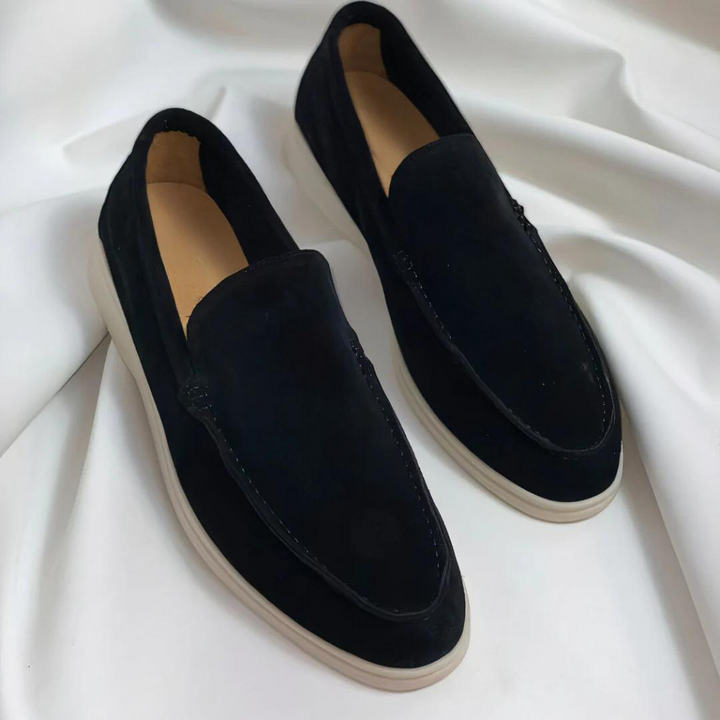 Stylish men's slip-on loafers in action, showcasing memory foam comfort & versatile smart-casual design.