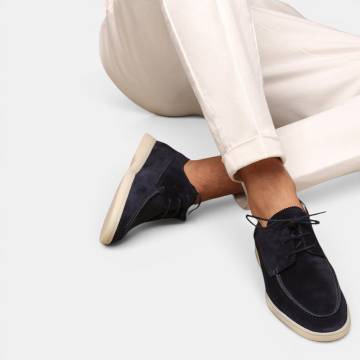 Men's elegant brown slip-on loafers, offering a comfortable fit and classic smart casual style.