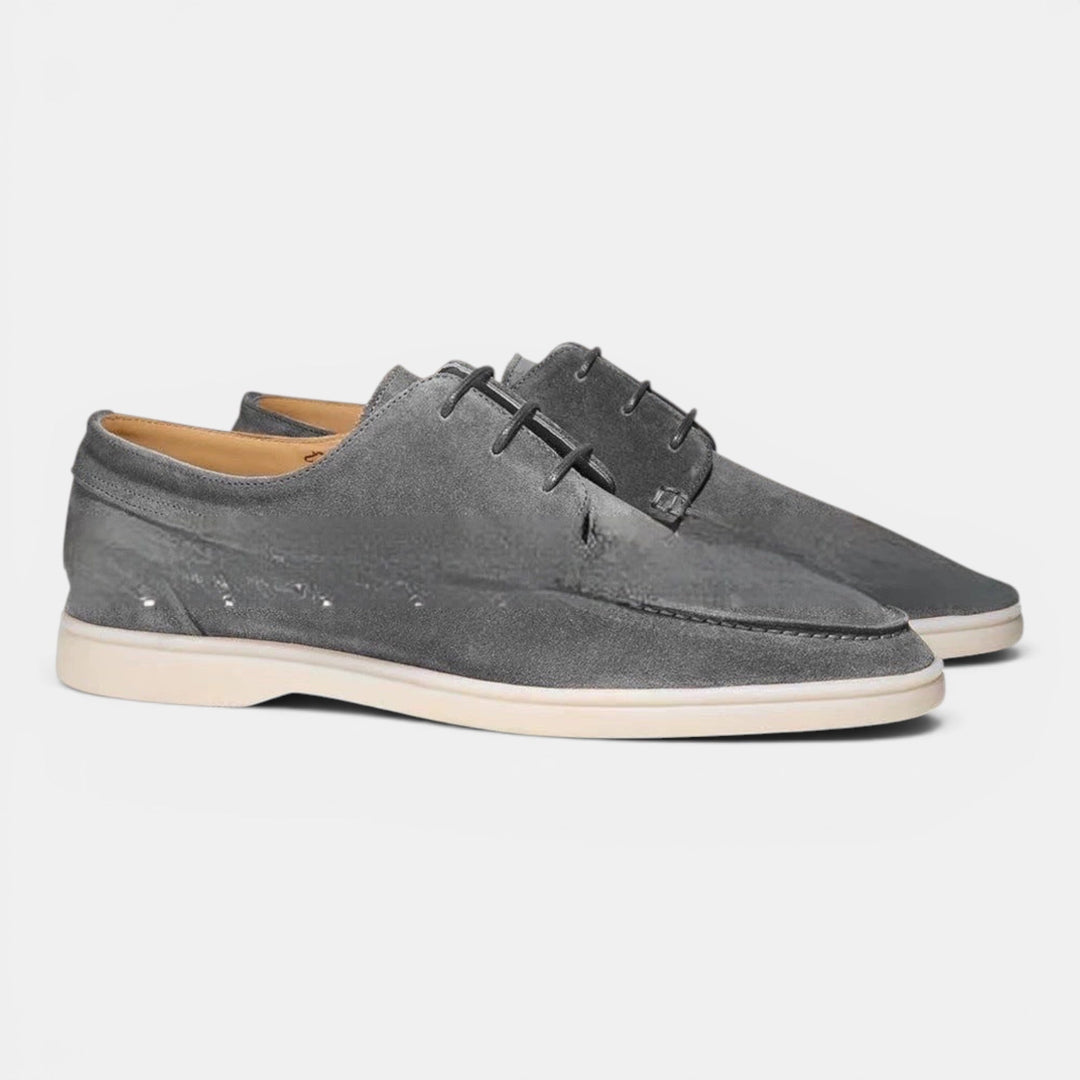 Elegant black men's slip-on loafers, ideal for smart casual outfits & comfortable driving.