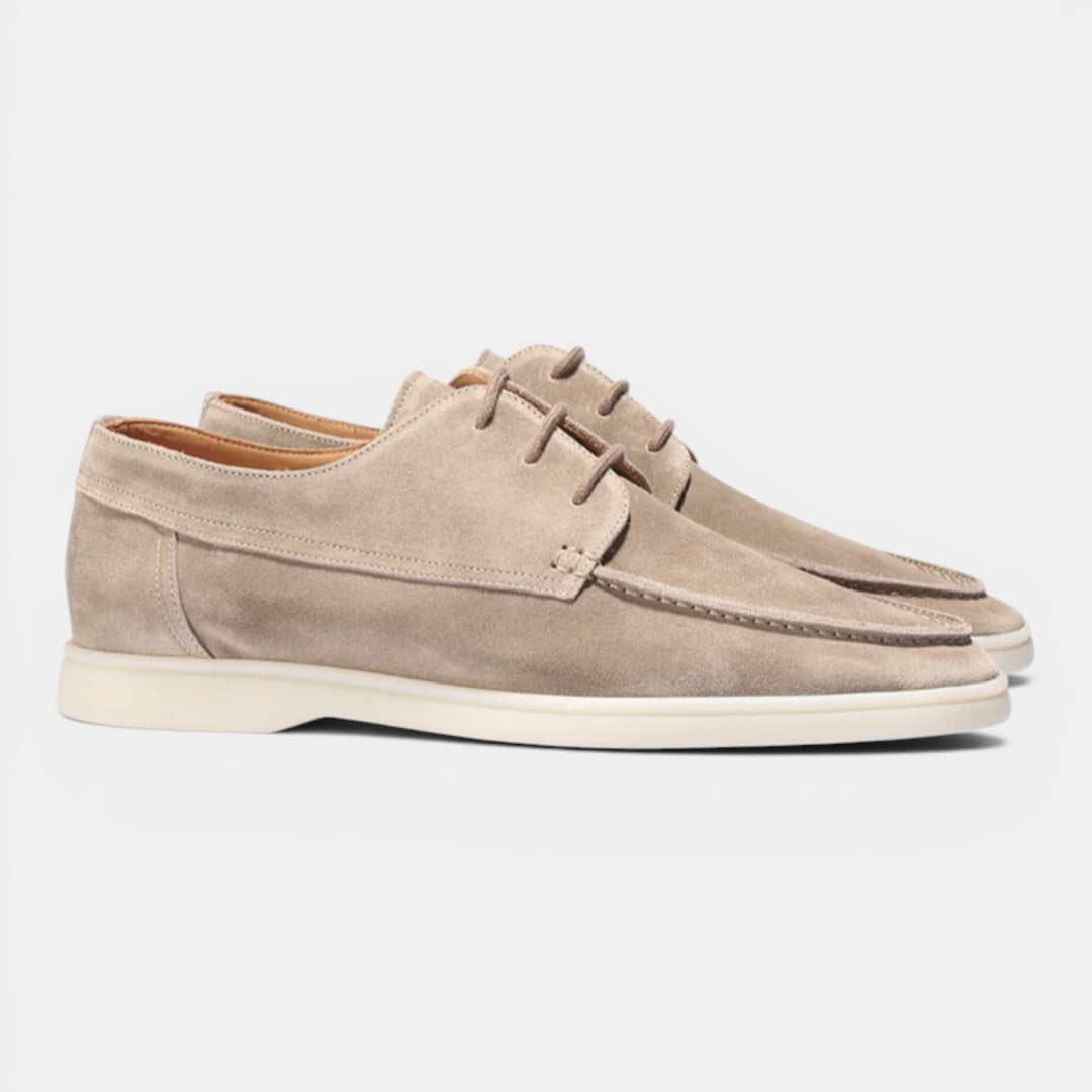 Tan leather men's slip-on loafers, offering comfort and a timeless smart casual appeal.
