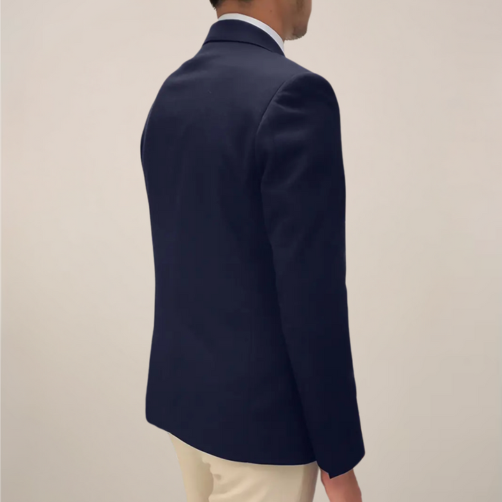 Elegant men's tailored blazer jacket in navy blue, showcasing polished style for smart casual and spring fashion.