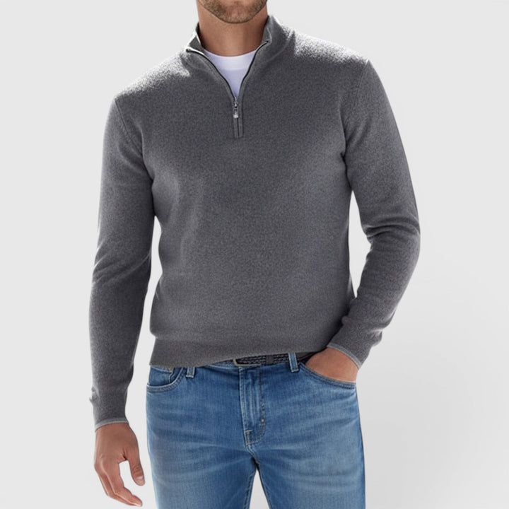 Soft knit men's quarter zip polo sweater, a comfortable pullover suitable for various occasions.