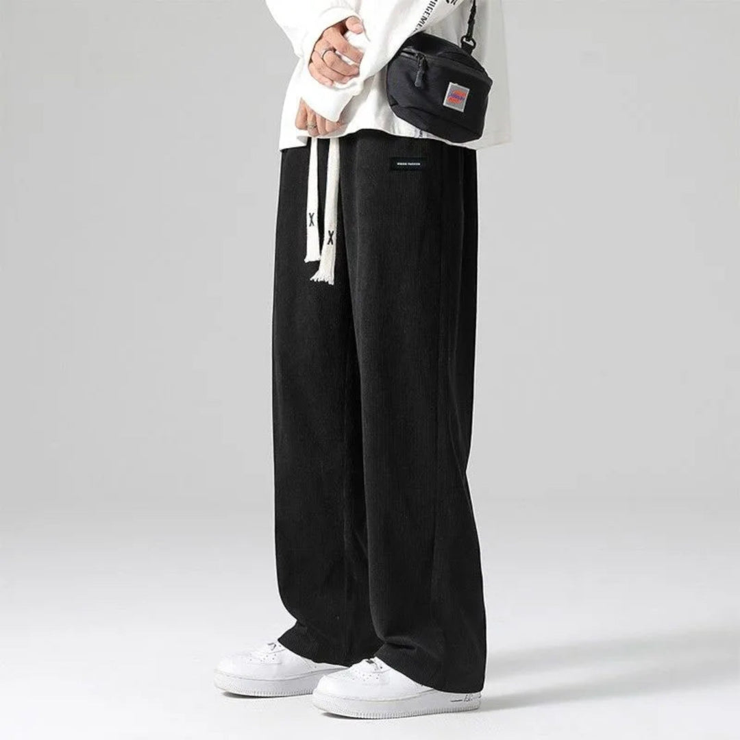 Sand colored men's soft wide leg sweatpants, featuring a drawstring waist for a relaxed, comfortable fit.