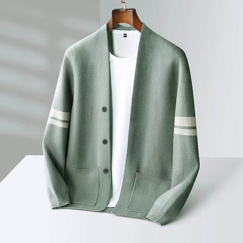 Modern men's knit cardigan for layering. Button-front design with fashionable striped sleeves.