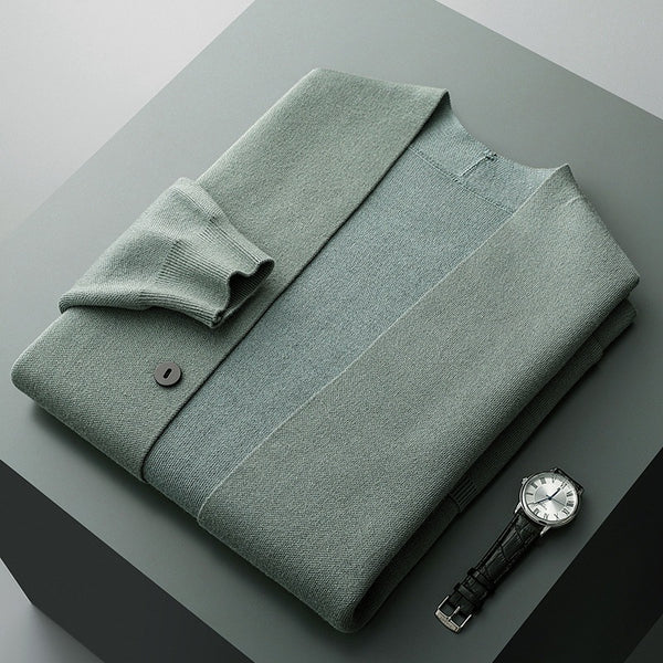 Detail shot of the button-front closure on a men's knit cardigan with distinctive striped sleeves.