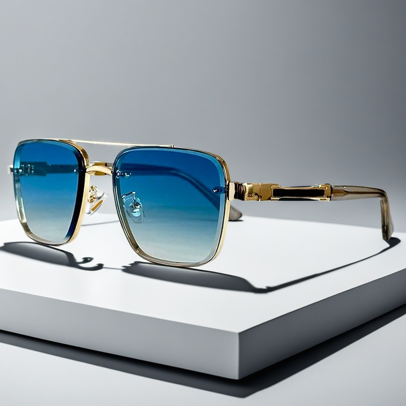 Men's squared frame sunglasses with a polished gold frame and trendy gradient lenses. Modern summer accessory.