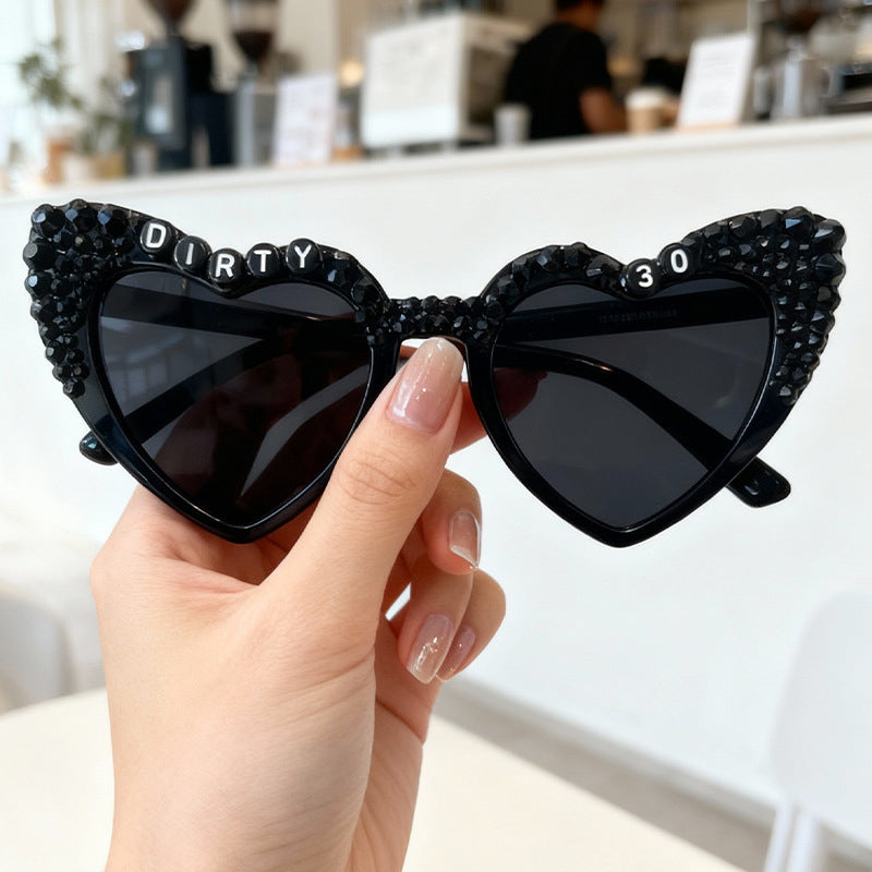 Men's stylish heart-frame sunglasses, providing both fashion and essential UV protection.