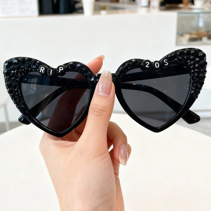 Unique men's heart-frame sunglasses, a standout fashion accessory for statement makers.