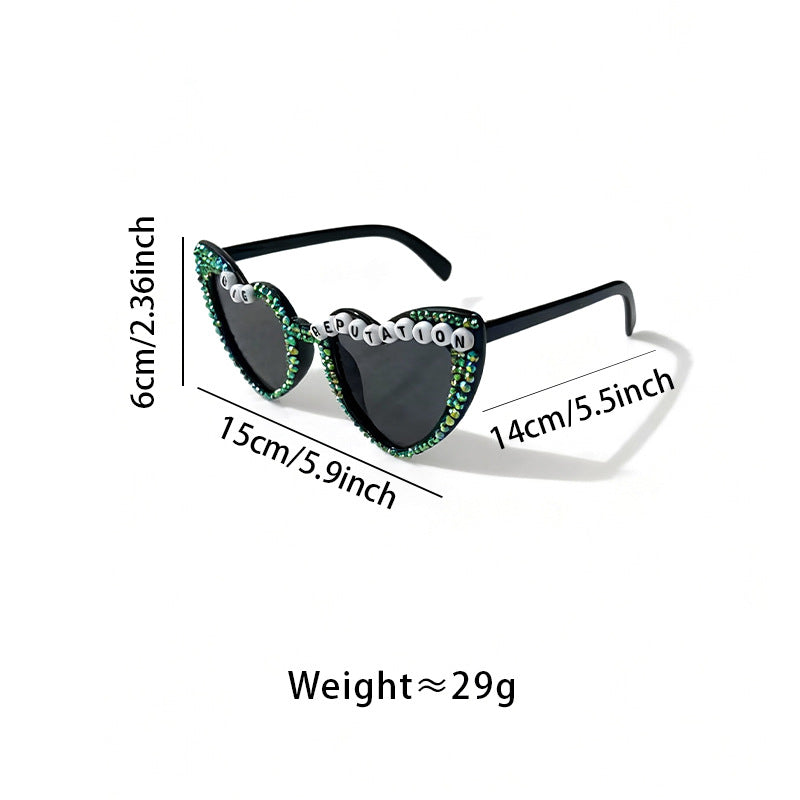 Stylish men's heart-frame sunglasses featuring sparkling rhinestone details and UV protection.