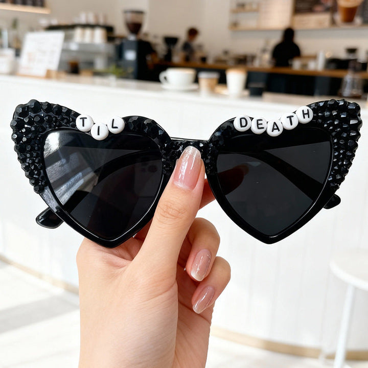 Men's rhinestone heart-frame sunglasses, combining high fashion with essential UV protection.