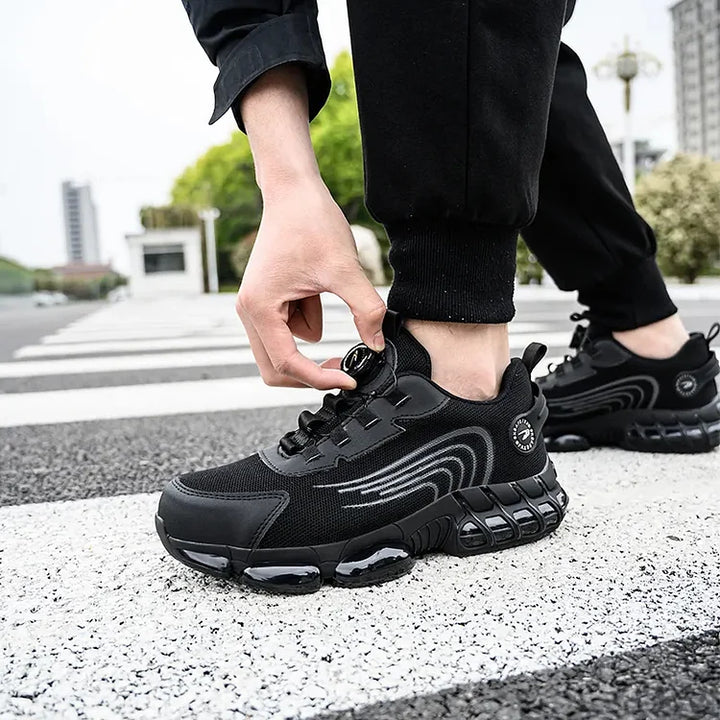 Men's puncture resistant work shoes with steel toe, non-slip sole, ensuring top safety.