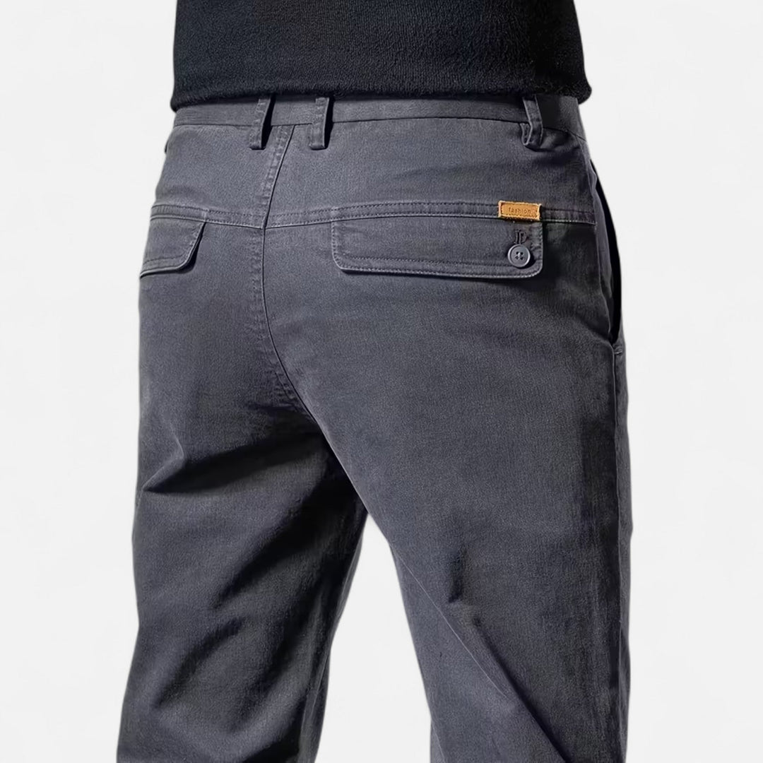 Man wearing men's straight-leg tailored trousers, demonstrating their elegant and refined style.