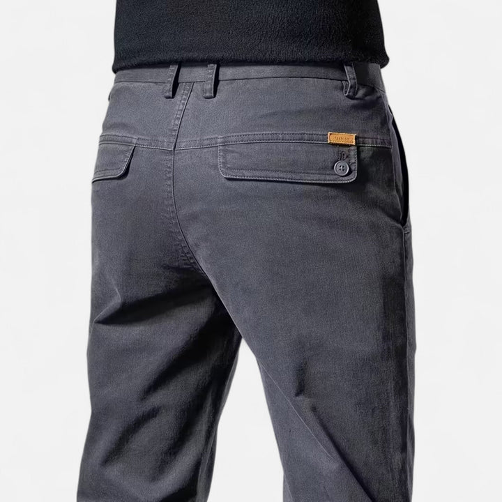 Man wearing men's straight-leg tailored trousers, demonstrating their elegant and refined style.