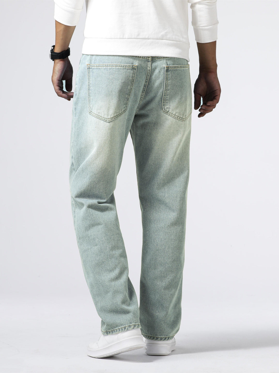 Men's straight fit washed jeans for daily comfort, a staple in modern casual fashion.