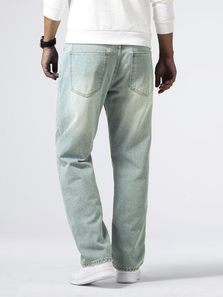 Men's straight fit washed jeans for daily comfort, a staple in modern casual fashion.