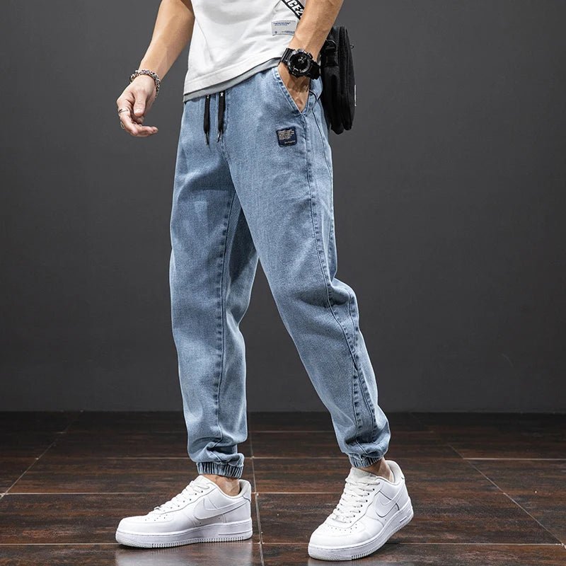 Men's stretch denim joggers with elastic waist & tapered fit for casual comfort. Ideal men's fashion.