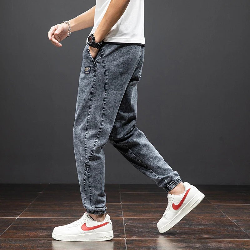 Versatile men's stretch denim joggers with comfort-fit elastic waist, perfect casual pants.