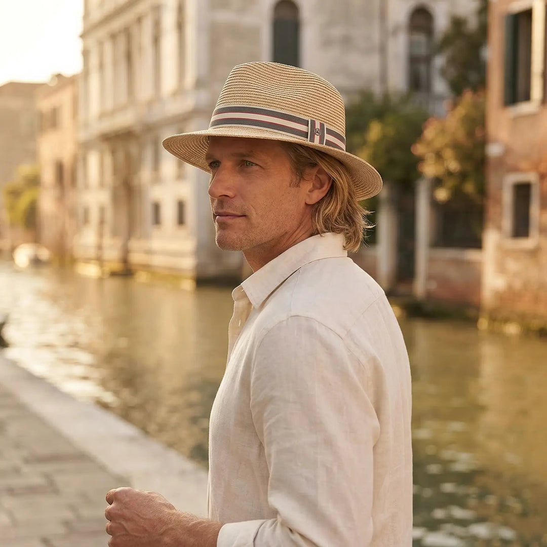 Classic men's fedora sun hat featuring a chic striped band, great for summer fashion & travel.