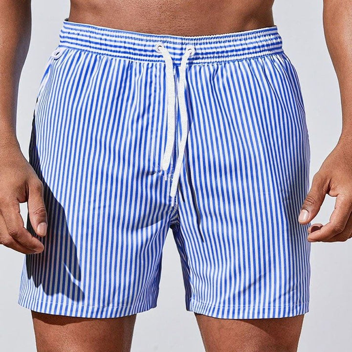 Men's striped drawstring swim shorts for beachwear, featuring an elastic waist and quick-dry fabric for summer.