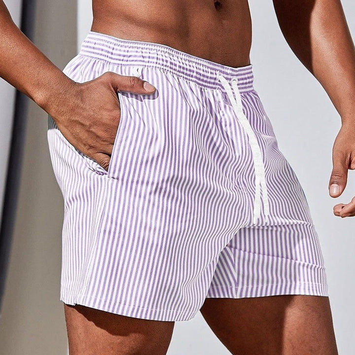 Men's casual striped swim shorts, ideal beachwear for swimming, relaxing by the pool, or summer activities.