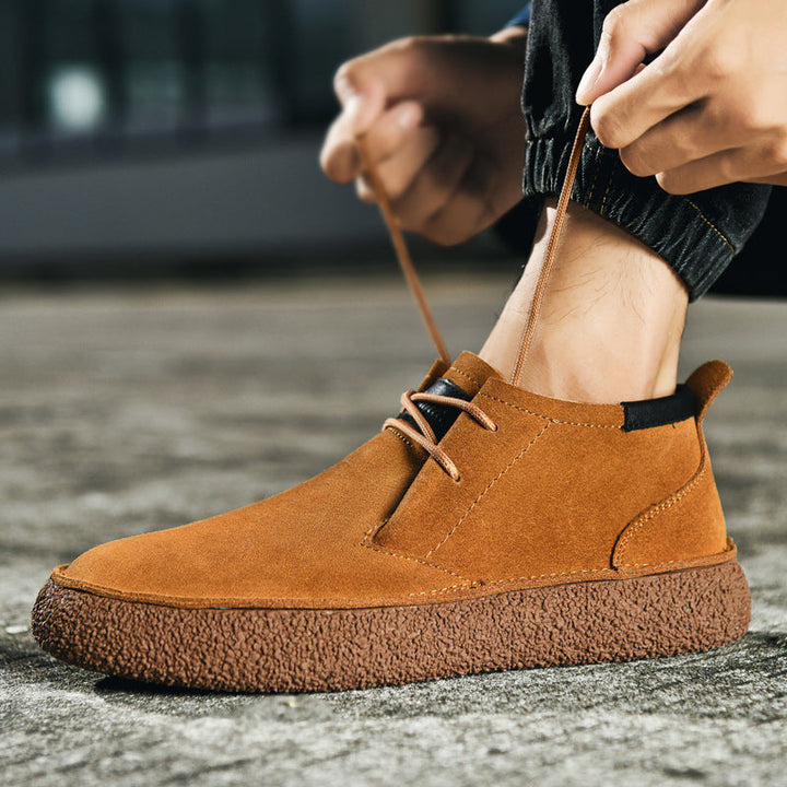 Versatile men's mid-top casual footwear with lace-up oxford style for everyday wear.
