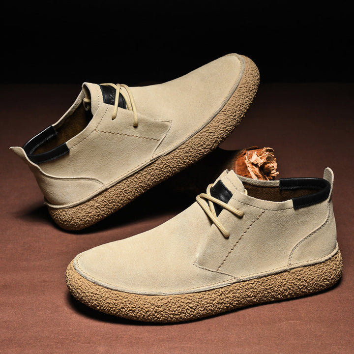 Lace-up men's mid-top shoes, offering a smart casual, structured design for modern urban style.