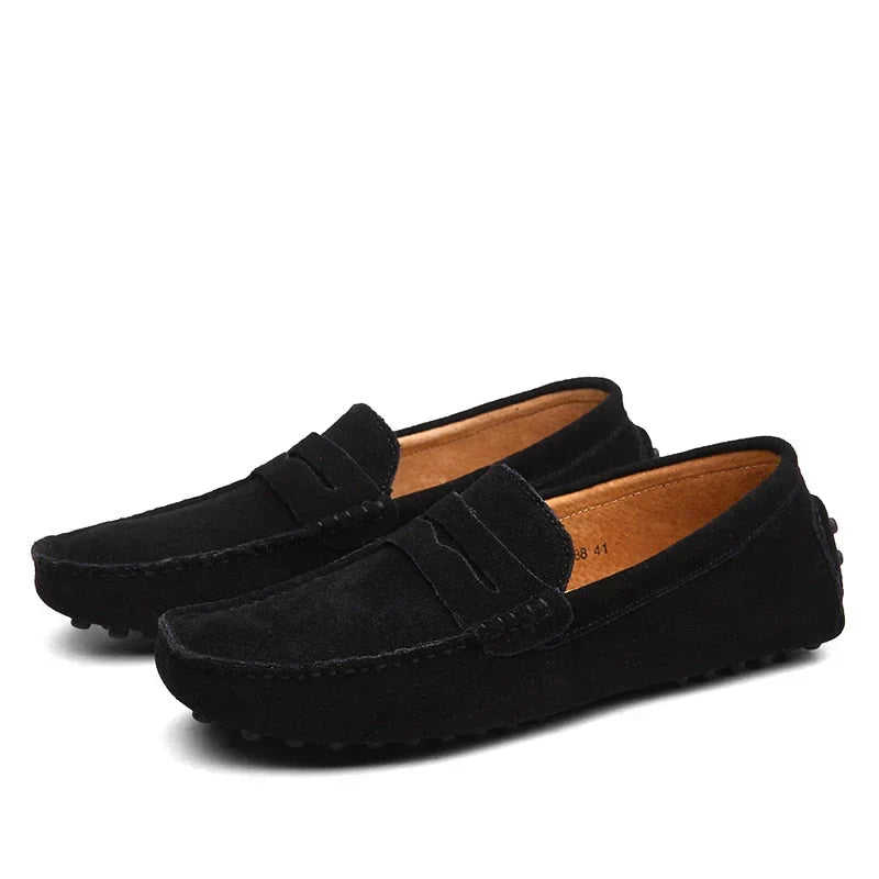 Men's sophisticated blue driving loafers with buckle. Comfortable slip-on shoes, stylish footwear.