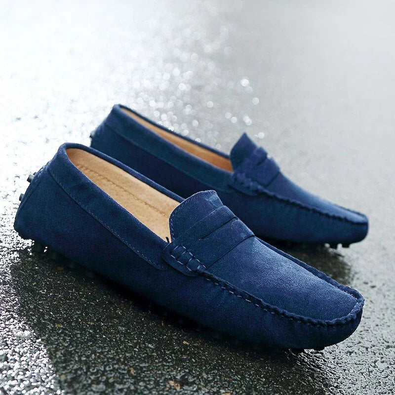 Men's stylish driving loafers near a car. Comfortable slip-on shoes, designed for effortless driving & style.
