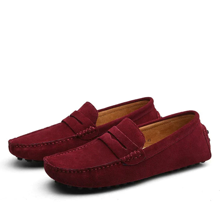 Top view of men's versatile navy blue driving loafers. Slip-on casual shoes, comfortable and stylish footwear.