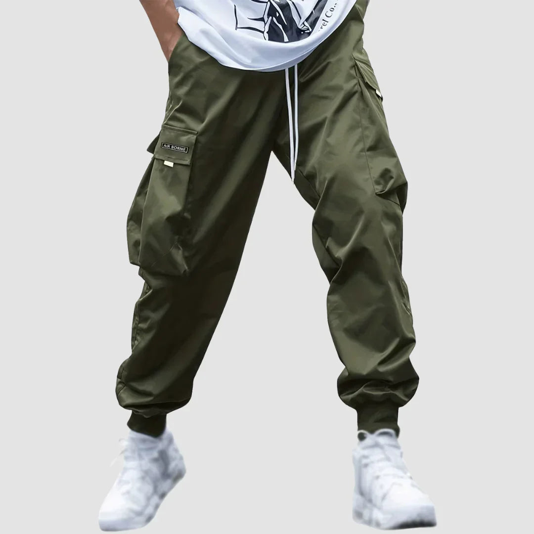 Modern tapered fit men's cargo pants in a versatile color, ideal for all-season casual fashion.
