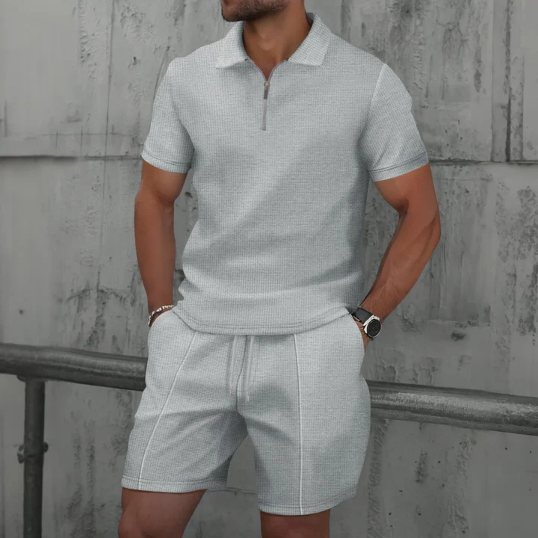 Close-up of men's drawstring shorts, part of a fashionable co-ord set with a matching polo shirt.