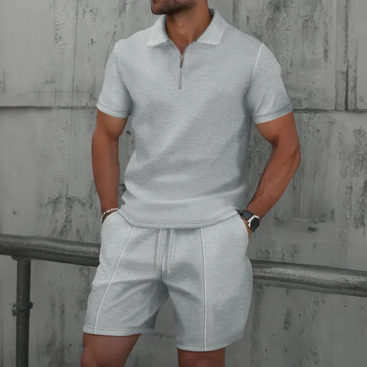 Close-up of men's drawstring shorts, part of a fashionable co-ord set with a matching polo shirt.