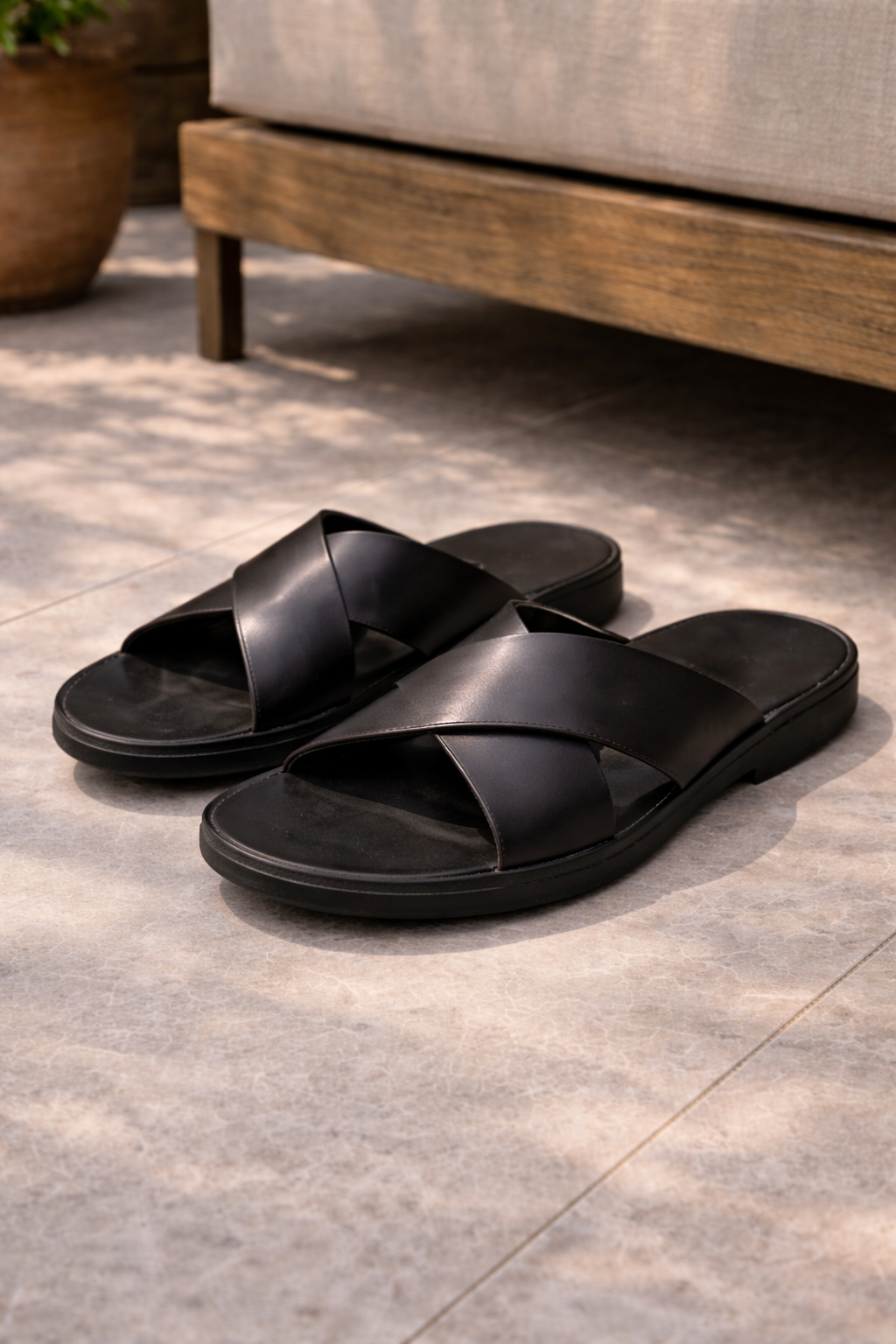 Versatile men's slide sandals with cross straps for casual summer wear. Comfortable slip-on warm weather footwear.