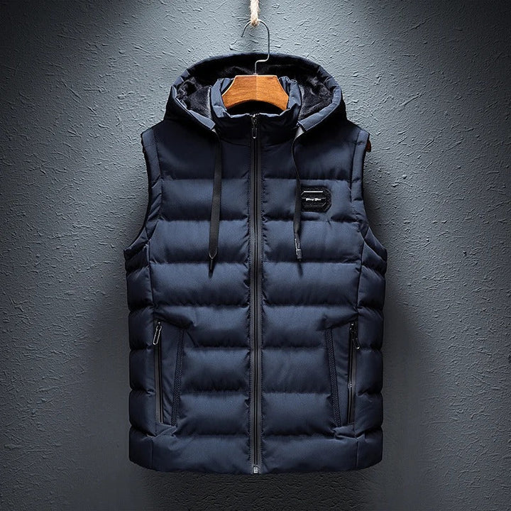 Modern men's Ethan quilted vest, featuring a comfortable hood and convenient pockets, great for layering.
