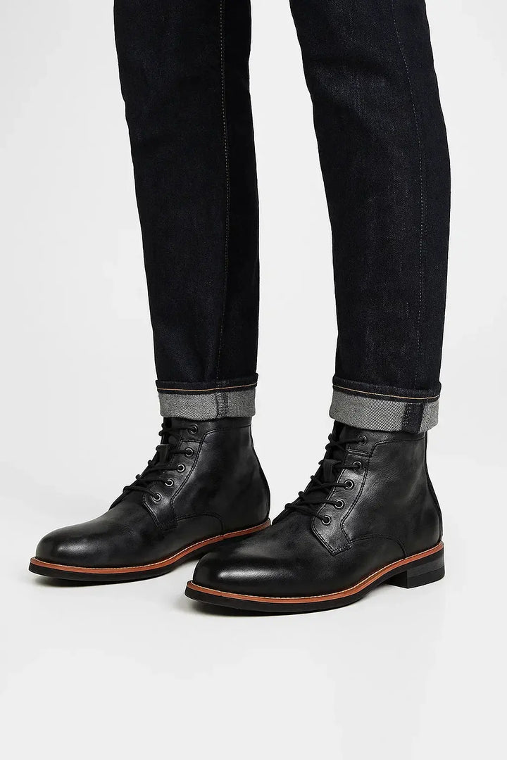 Men's stylish lace-up ankle boots. Durable and comfortable black leather footwear for daily wear or formal occasions.