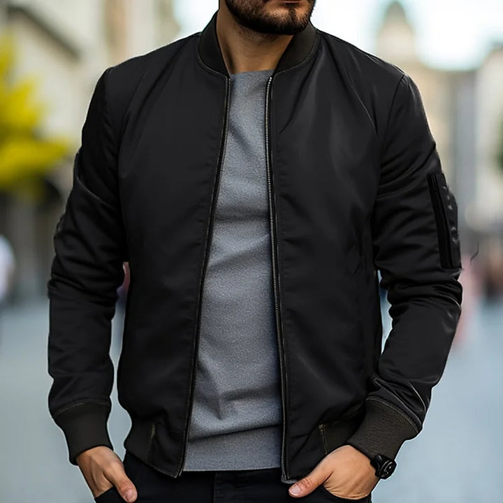 Stylish men's lightweight bomber jacket. Modern design with ribbed collar, cuffs, and hem. Great for casual fashion.
