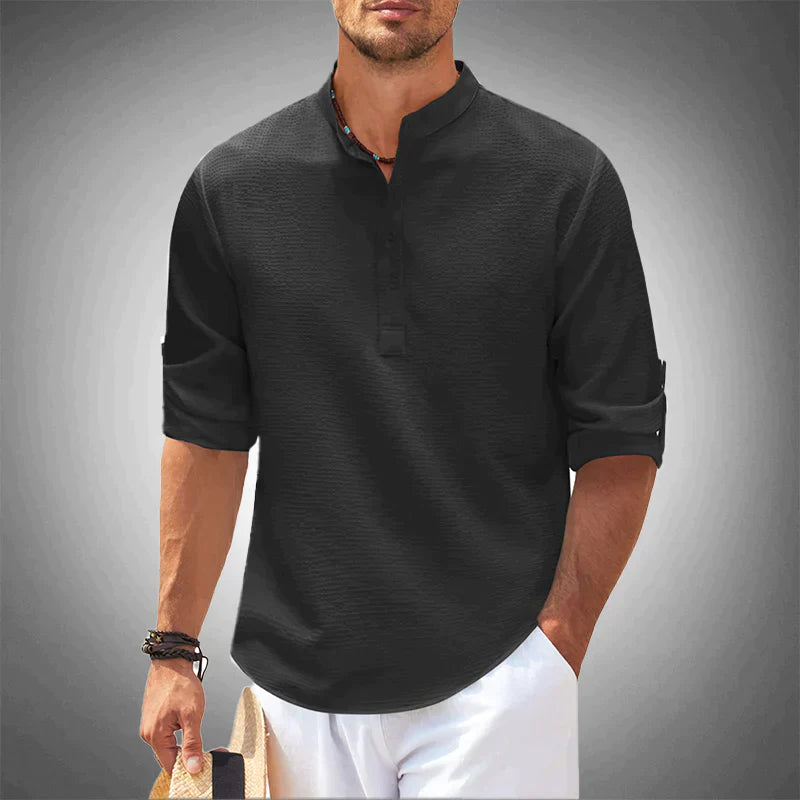 Close-up of a men's stylish button-down long sleeve shirt, showcasing tailored fit for versatile outfits.