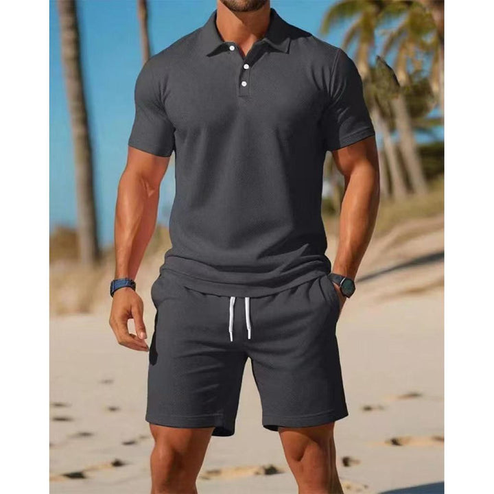Comfortable men's two-piece polo shirt and drawstring shorts outfit, ideal for relaxing at home.