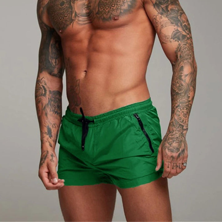 Comfortable men's stretchy quick dry swimwear, perfect beach shorts for summer vacation.