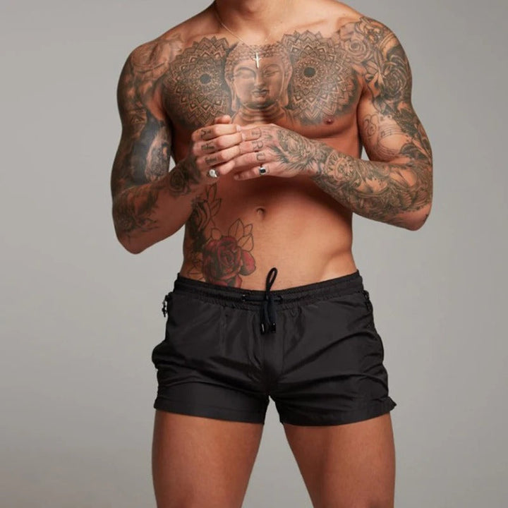 Stretchy quick dry men's swim shorts, performance active wear for pool, beach, and water sports.