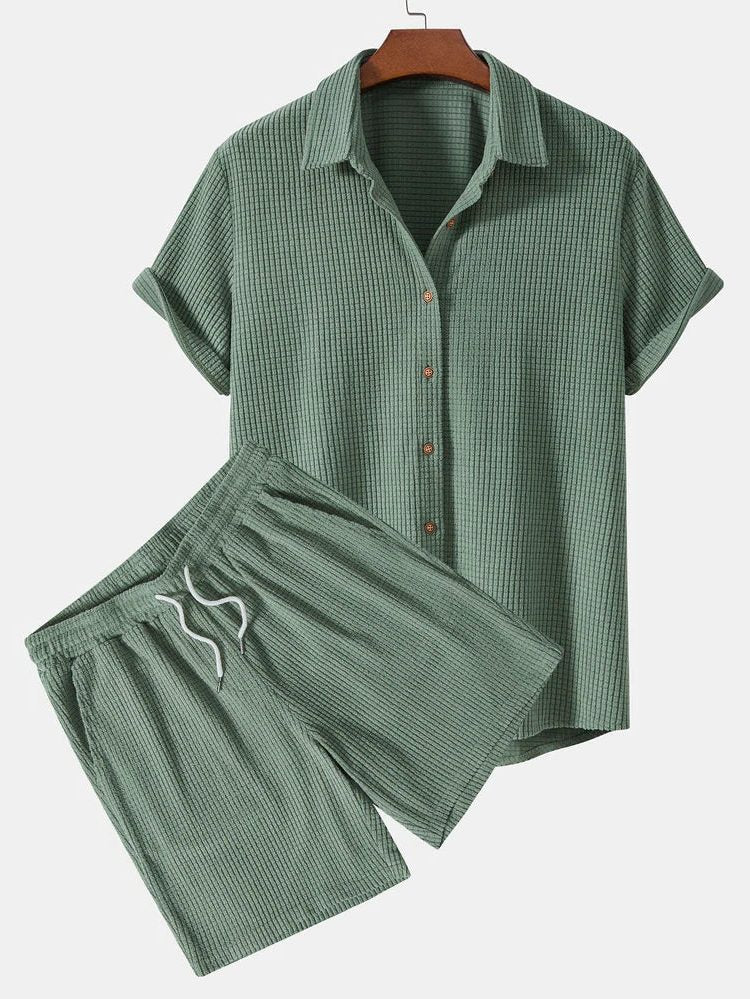 Comfortable men's relaxed fit two-piece shorts set with short sleeve button shirt & elastic waist.