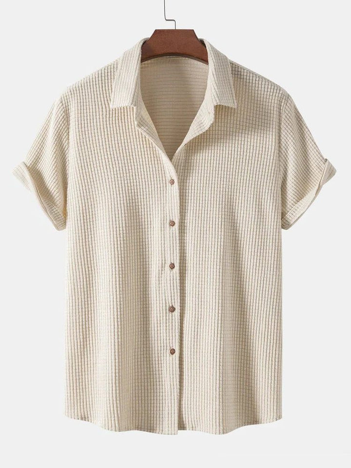 Men's two-piece short sleeve button shirt & elastic waist shorts set. Relaxed fit, ideal for summer.