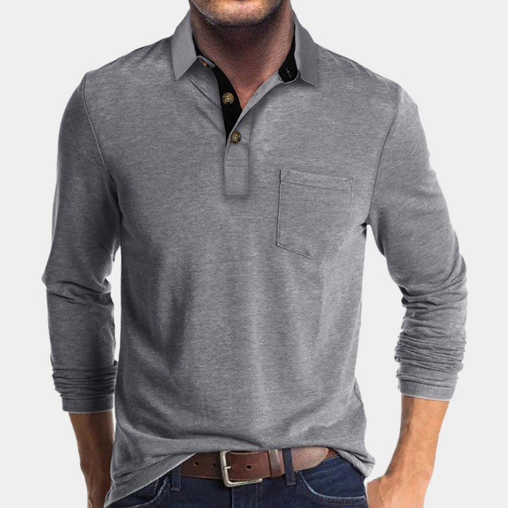 Men's fashion model wearing a tailored fit short-sleeve polo shirt, showcasing versatile smart casual style.